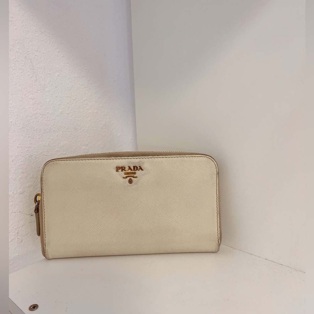 PRADA :Measurement: 8”L W  5”H.      Closure/ opening single zip/ Inter. Leather